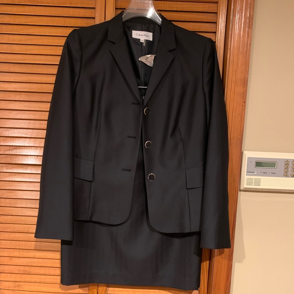 Mid length pencil skirt suit